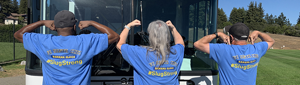 photo of three bus drivers with Slug Strong shirts